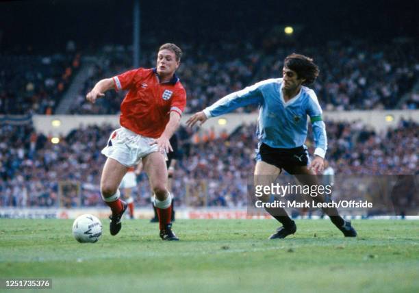 May 1990 Wembley - England v Uruguay Friendly International Football Match :, Paul Gascoigne of England is challenged by Uruguay captain Enzo...