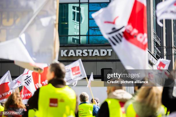 April 2023, Berlin: Participants of a rally on the occasion of the warning strike at Galeria, Ikea and Thalia have gathered in front of the Galeria...