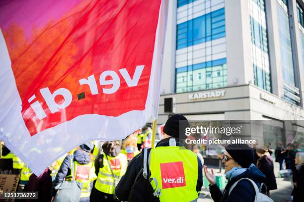 April 2023, Berlin: Participants of a rally on the occasion of the warning strike at Galeria, Ikea and Thalia have gathered in front of the Galeria...