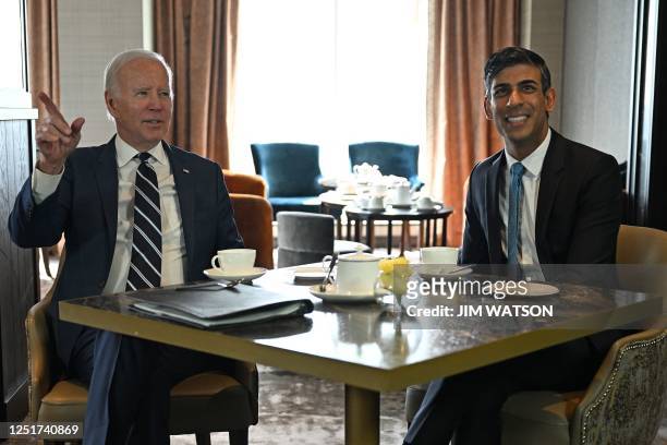 President Joe Biden reacts as he meets with Britain's Prime Minister Rishi Sunak in Belfast on April 12 as part of a four day trip to Northern...
