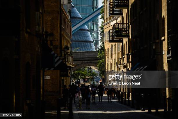 Distinctive curved line of the current City Hall building is seen between the buildings of Shad Thames on June 24, 2020 in London, England. Mayor of...