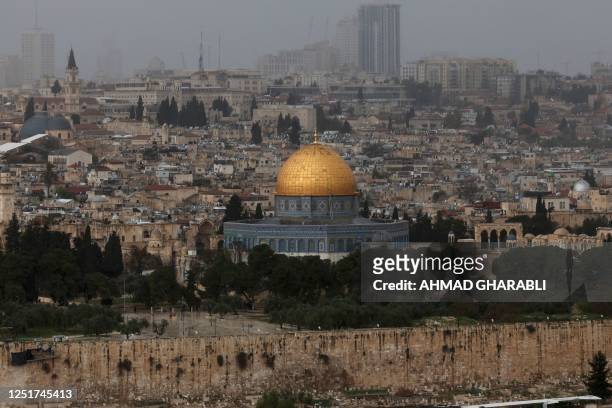 Picture shows a view of the al-Aqsa mosque complex and its Dome of the Rock mosque in Jerusalem on a rainy day, on April 12, 2023.