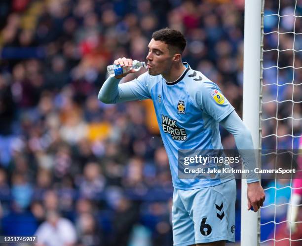 Cambridge United's Lloyd Jones drinks water during the Sky Bet League One between Bolton Wanderers and Cambridge United at University of Bolton...