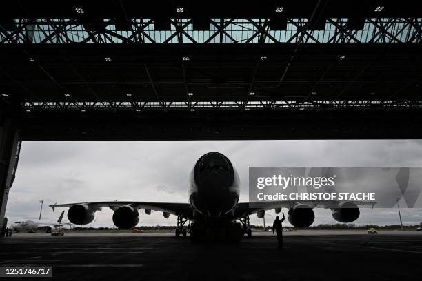 An Airbus A380-800 of German airline Lufthansa arrives inside a hangar after its arrival at Munich International Airport, Munich, southern Germany,...