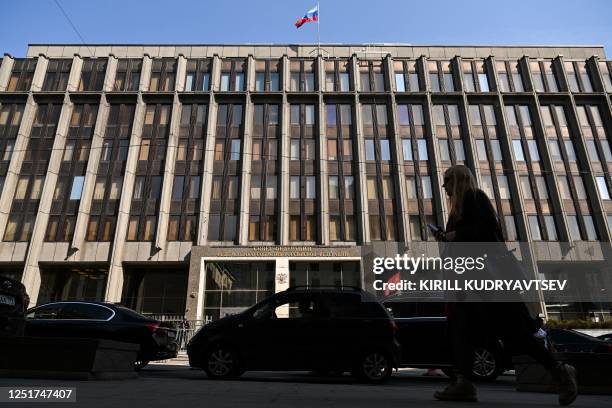 Pedestrian walks past the Federation Council building, the upper chamber of Russia's parliament in central Moscow on April 12 shows a general view -...