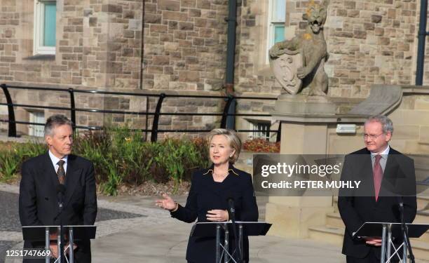 Secretary of State Hillary Clinton addresses a press conference with Northern Ireland's First Minister Peter Robinson and Deputy First Minister...