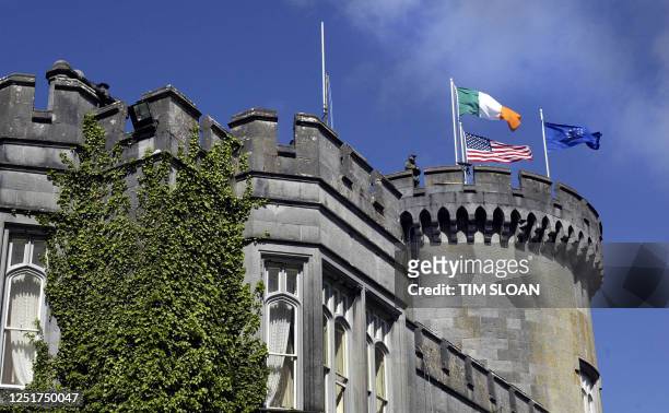 Security official stands guard atop Dromoland Castle where US President George W. Bush spent the night and location of the US-EU Summit 26 June 2004,...