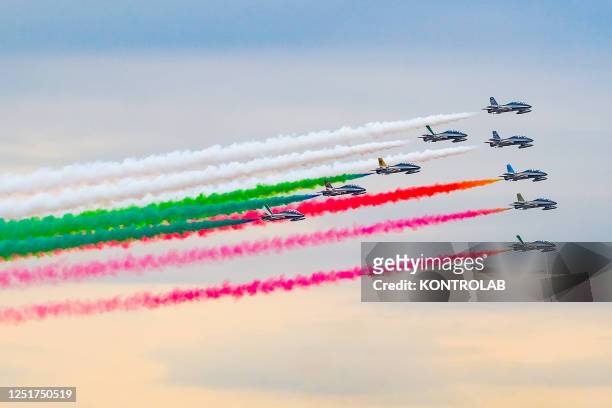 Italian Air Force aerobatic unit Frecce Tricolori planes spreads smoke with the colors of the Italian flag over the city during the swearing-in...