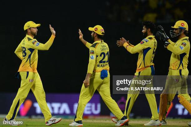 Chennai Super Kings' Ravindra Jadeja celebrates with teammates after taking the wicket of Rajasthan Royals' Devdutt Padikkal during the Indian...