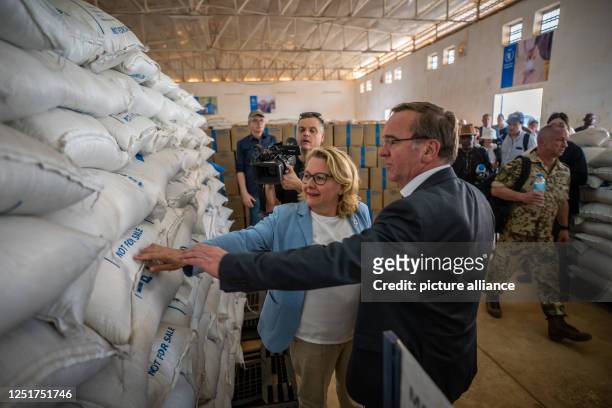 April 2023, Niger, Niamey: Svenja Schulze , Federal Minister for Economic Cooperation and Development, visits a warehouse of the UN World Food...
