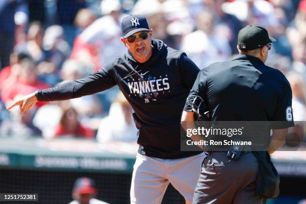 Aaron Boone of the New York Yankees argues a review call with home plate umpire Chris Guccione after being ejected from the game during the first...