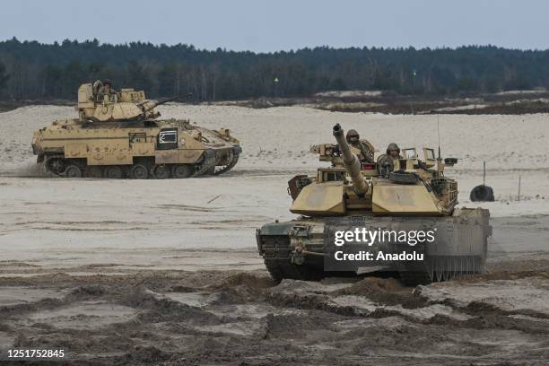 American soldiers of the 2nd Battalion, 70th Armor Regiment, 2nd Armored Brigade Comat Team, 1st Infantry Division supporting the 4th Infantry...