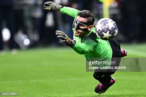 Napoli's Italian goalkeeper Alex Meret warms up prior to the UEFA Champions League quarter-finals first leg football match between AC Milan and SSC...