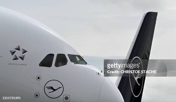 The cockpit of an Airbus A380-800 of German airline Lufthansa is seen in front of a aircraft tail at the Franz-Josef-Strauss airport in Munich,...