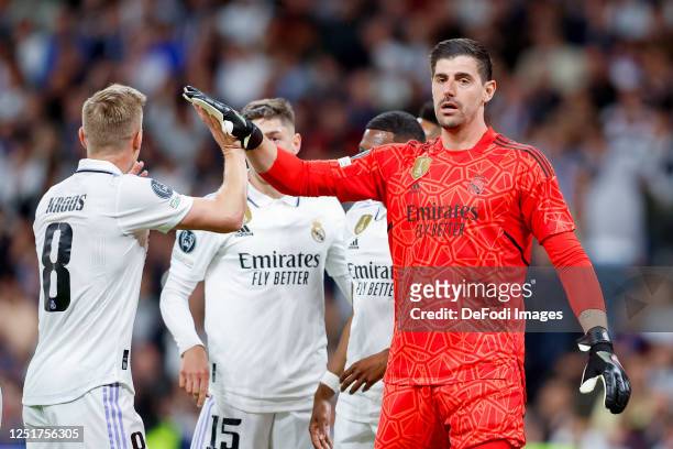 Toni Kroos of Real Madrid and goalkeeper Thibaut Courtois of Real Madrid gestures during the UEFA Champions League quarterfinal first leg match...