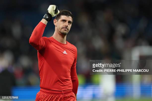 Real Madrid's Belgian goalkeeper Thibaut Courtois celebrates their victory at the end of the UEFA Champions League quarter final first leg football...