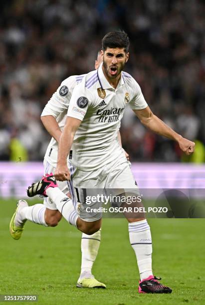 Real Madrid's Spanish midfielder Marco Asensio celebrates scoring his team's second goal during the UEFA Champions League quarter final first leg...