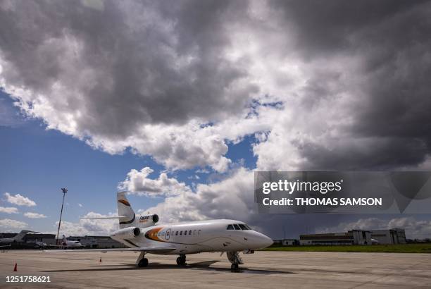 This photograph taken on April 12, 2023 shows a Dassault Falcon 900 airplane parked on the tarmac of Le Bourget Airport in Le Bourget, Northern Paris.