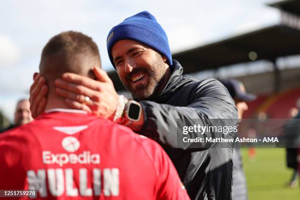 Wrexham co-owner Ryan Reynolds greets Ollie Palmer of Wrexham during the Vanarama National League fixture between Wrexham and Notts County at The...