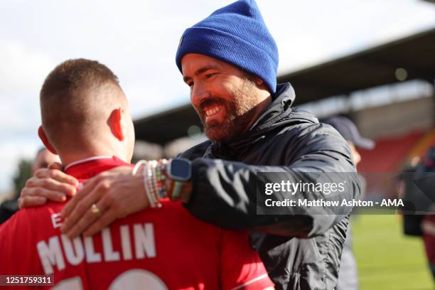 Wrexham co-owner Ryan Reynolds greets Ollie Palmer of Wrexham during the Vanarama National League fixture between Wrexham and Notts County at The...