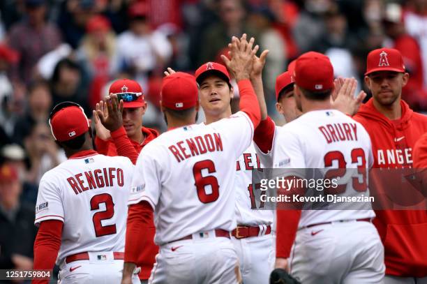 Shohei Ohtani of the Los Angeles Angels congratulates his teammates after defeating the Washington Nationals, 3-2, at Angel Stadium of Anaheim on...