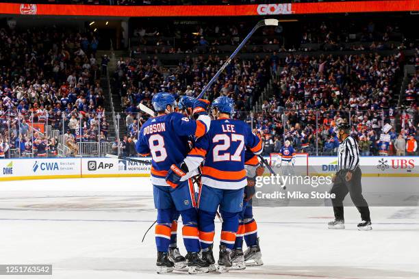 Anders Lee of the New York Islanders is congratulated by his teammates after scoring a goal against the Montreal Canadiens during the third period at...