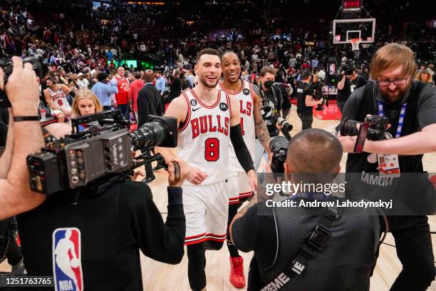 Zach LaVine and DeMar DeRozan of the Chicago Bulls celebrate after defeating the Toronto Raptors during the 2023 Play-In Tournament at the Scotiabank...