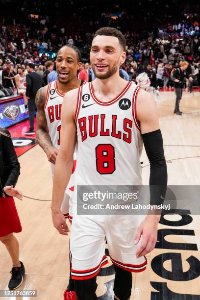 Zach LaVine and DeMar DeRozan of the Chicago Bulls walk off the court after defeating the Toronto Raptors during the 2023 Play-In Tournament at the...