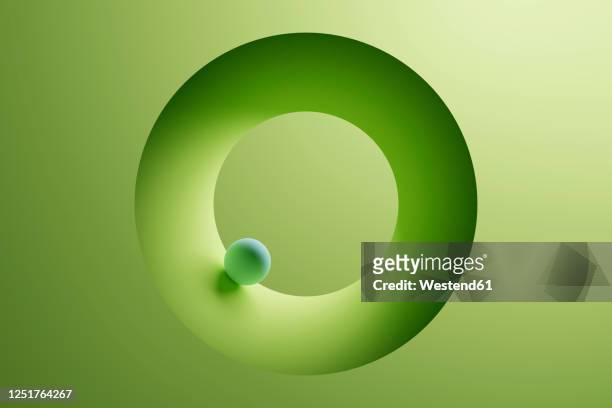 three dimensional render of small sphere inside green ring - three dimensional stock illustrations