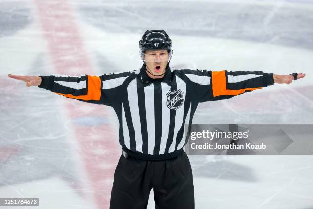 National Hockey League referee Steve Kozari waves off a goal after a video review during second period action between the Calgary Flames and the...