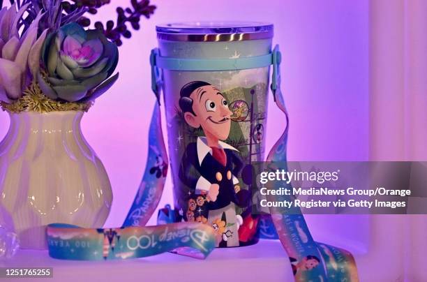 Anaheim, CA A tumbler with a cartoon image of Walt Disney is one of the 100 anniversary collectibles available at the Disneyland Resort in Anaheim,...