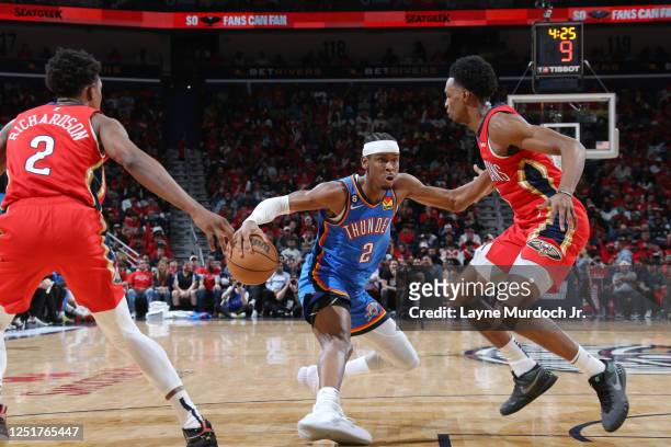 Shai Gilgeous-Alexander of the Oklahoma City Thunder dribbles the ball during the game against the New Orleans Pelicans during the 2023 Play-In...