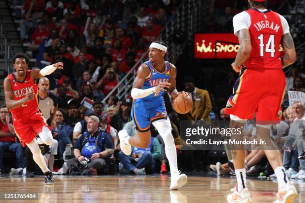 Shai Gilgeous-Alexander of the Oklahoma City Thunder dribbles the ball during the game against the New Orleans Pelicans during the 2023 Play-In...