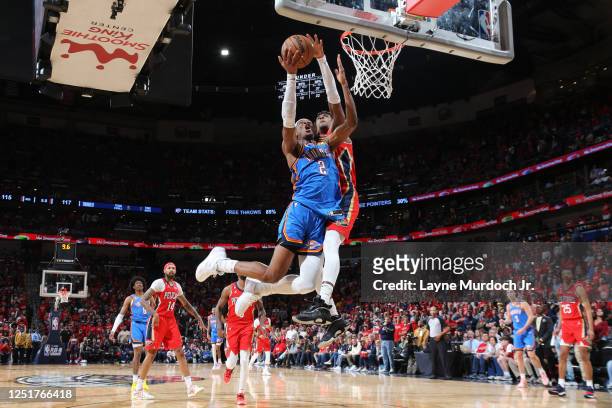 Shai Gilgeous-Alexander of the Oklahoma City Thunder drives to the basket during the game against the New Orleans Pelicans during the 2023 Play-In...