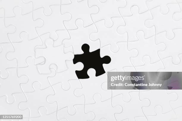 the last piece and missing part. jigsaw puzzle. - closing gap stock pictures, royalty-free photos & images