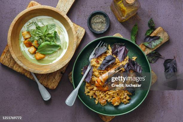 traditional italian dishes for family dinner. vegetable soup with croutons and orzo pasta with prawns - chaudiere stock pictures, royalty-free photos & images