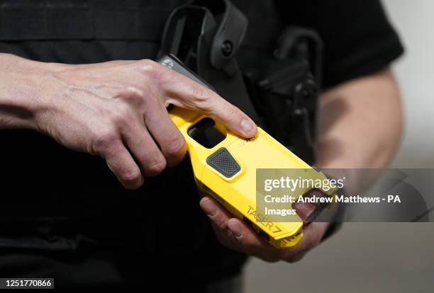 An officer holds the new Taser 7 during a demonstration as Hampshire and Isle of Wight Constabulary and Thames Valley Police launch the rollout of...