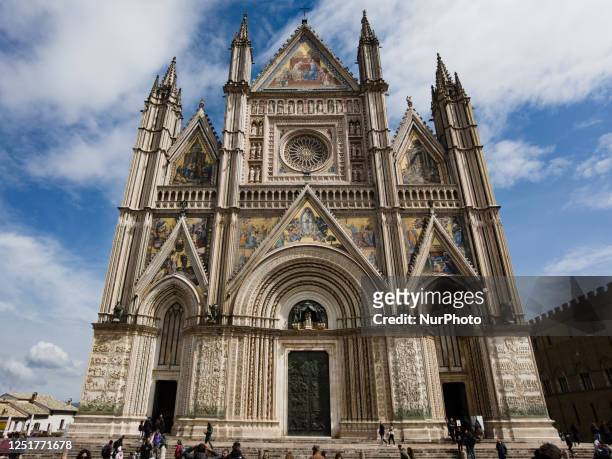 People and tourists are seen out of Orvieto Cathedral in Orvieto, Umbria, Italy, on april 8. 2023. Duomo di Orvieto cathedral is the most important...