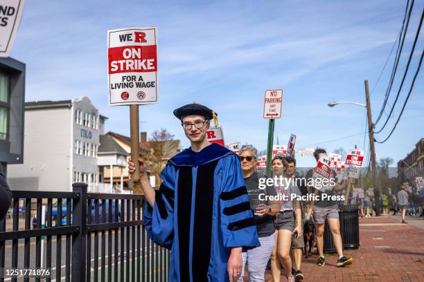 Professor of English at Rutgers University, Andrew Goldstone, participates in a strike at the university's main campus in New Brunswick. The three...