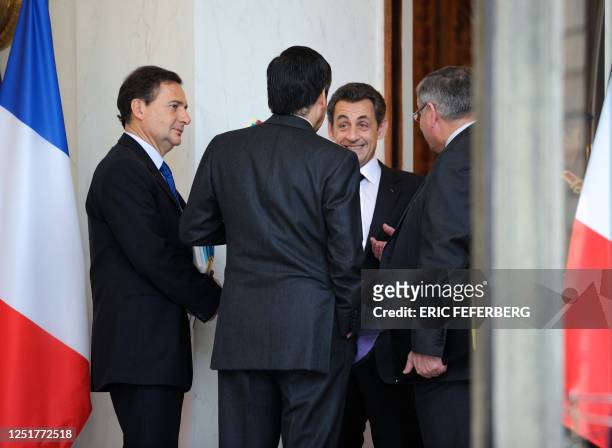 French President Nicolas Sarkozy chats with French Justice Minister Michel Mercier , French Prime Minister Francois Fillon and French Energy and...