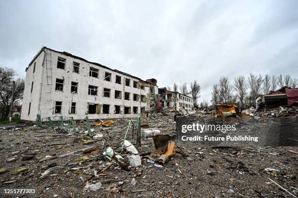 Rusty bus is seen outside the Suziria gymnasium which Russian occupiers hit at least four times, Orikhiv, Zaporizhzhia Region, southeastern Ukraine.