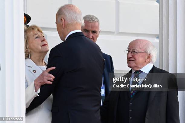 President Joe Biden says goodbye to Irish President Michael D Higgins and his wife Sabina Higgins outside the Irish President's official residence...