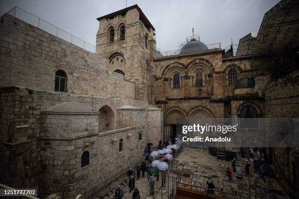 View of the Church of the Holy Sepulchre as people attend the mass on Holy Thursday ahead of Easter celebration in the old city of Jerusalem on April...