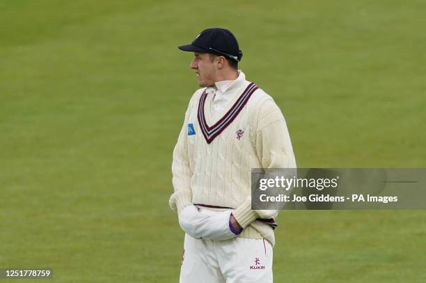 Somerset's Tom Kohler-Cadmore uses a hand warmer during day one of the LV= Insurance County Championship, Division One match at Trent Bridge,...