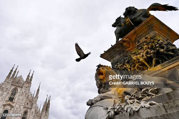 The equestrian statue of Vittorio Emanuele II located at Piazza Duomo in central Milan is pictured on April 13 still covered in yellow paint, more...