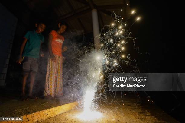 Kids play with fireworks to celebrate the Sinhala and Tamil New Year festival on April 13 in Ratnapura, Sri Lanka. Sri Lanka's Sinhala and Tamil New...