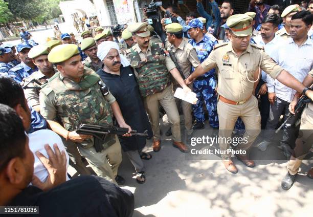 Atiq Ahmad is taken to prison by police from session court , in Allahabad on April 13 2023.