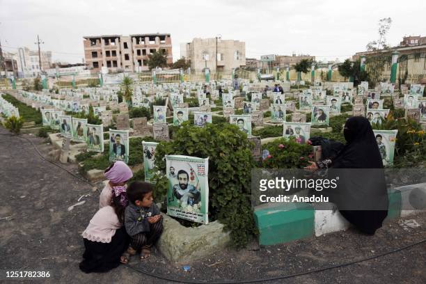 Families in Sanaa, the capital of Yemen, visit the graves of their relatives who lost their lives in clashes in the 9th year of the civil war in the...