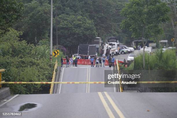 Police cordon off the scene after El Alambrado bridge over the La Vieja river collapsed on April 13, 2023. At least two people died and 15 were...