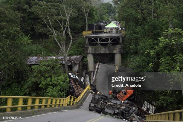 View of a collapsed bridge across the La Vieja River connecting the departments of Valle del Cauca and Quindio in Colombia killed 2 people and...